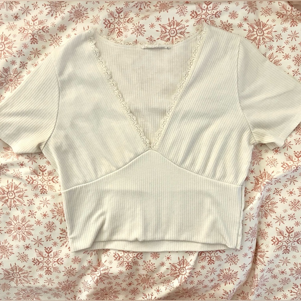 White v-neck crop top.